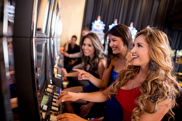 Live dealer at roulette table, multiple camera angles visible on mobile screen